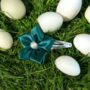 green ribbon flower pin