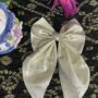 golden tail bow pin golden tail bow pin