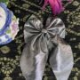 silver tail bow pin silver tail bow pin
